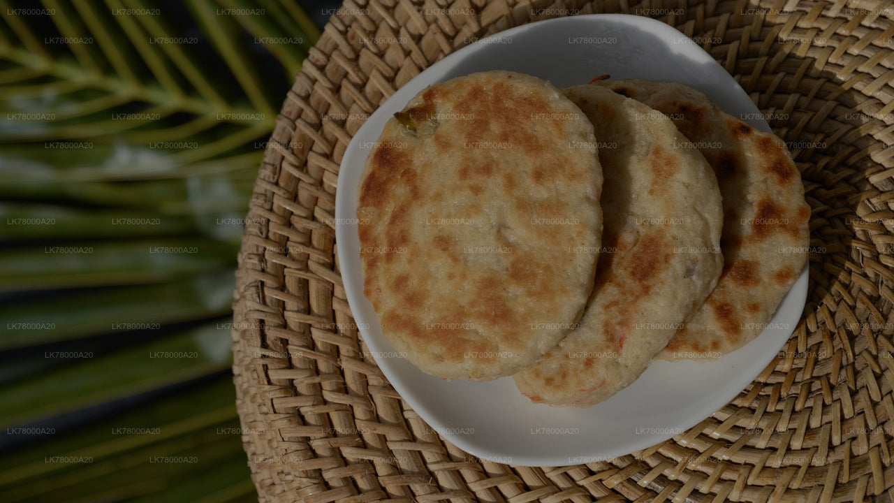 Three round, flatbreads on a white plate with a woven mat background